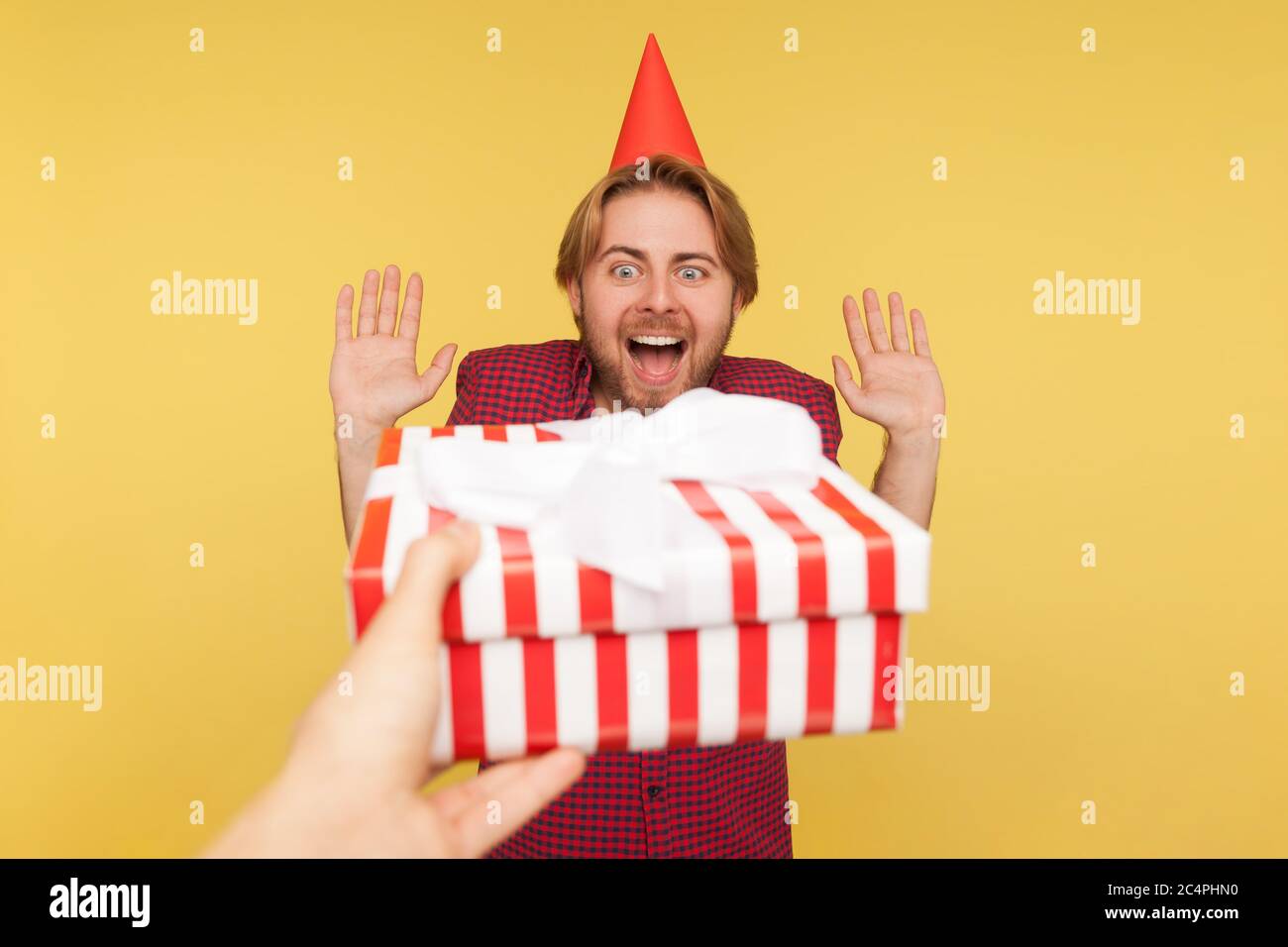 Pov Hand Giving Wrapped T Box To Guy With Party Cone On Head Excited Man Raising Hands