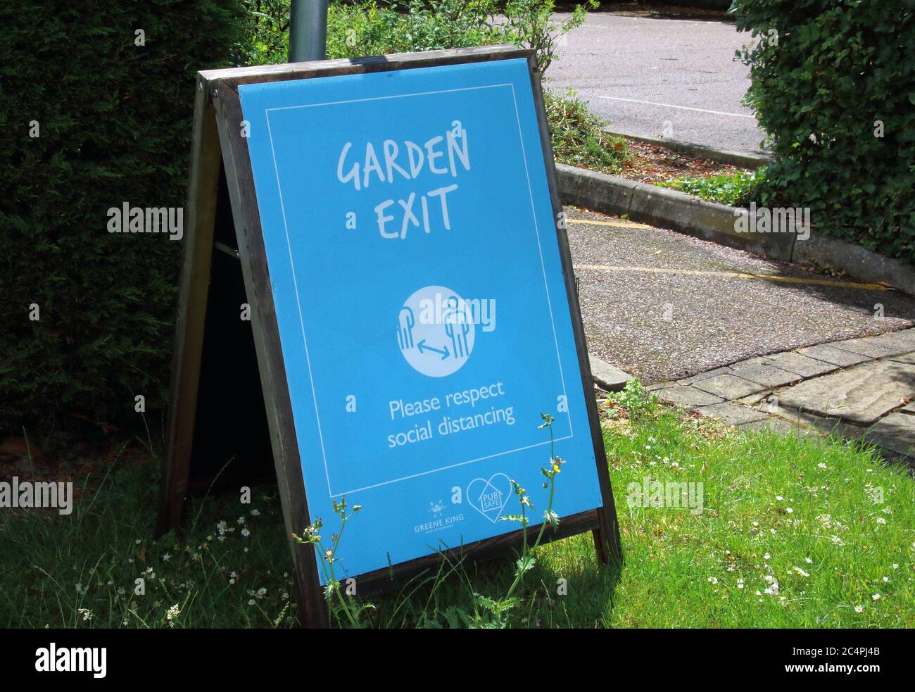 Milton Keynes, UK. 27th June, 2020. An exit sign in the garden of one of the pubs in the scheme.All Greene King's pubs will follow a new set of Pub Safe promises, ahead of their re-opening designed to care for its team members and ensure customers can socialize safely. Credit: SOPA Images Limited/Alamy Live News Stock Photo