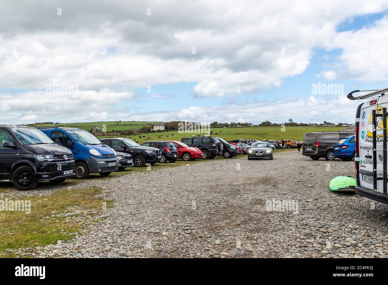 Garretstown, West Cork, Ireland. 28th June, 2020. Despite the near gale force winds, hundreds of tourists and locals alike descended on Garretstown Beach today. Credit: AG News/Alamy Live News Stock Photo