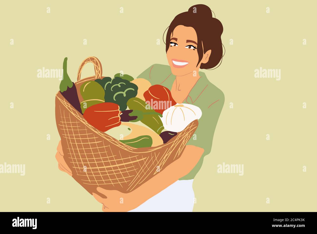 Portrait of a beautiful young woman with basket full of freshly picked ...