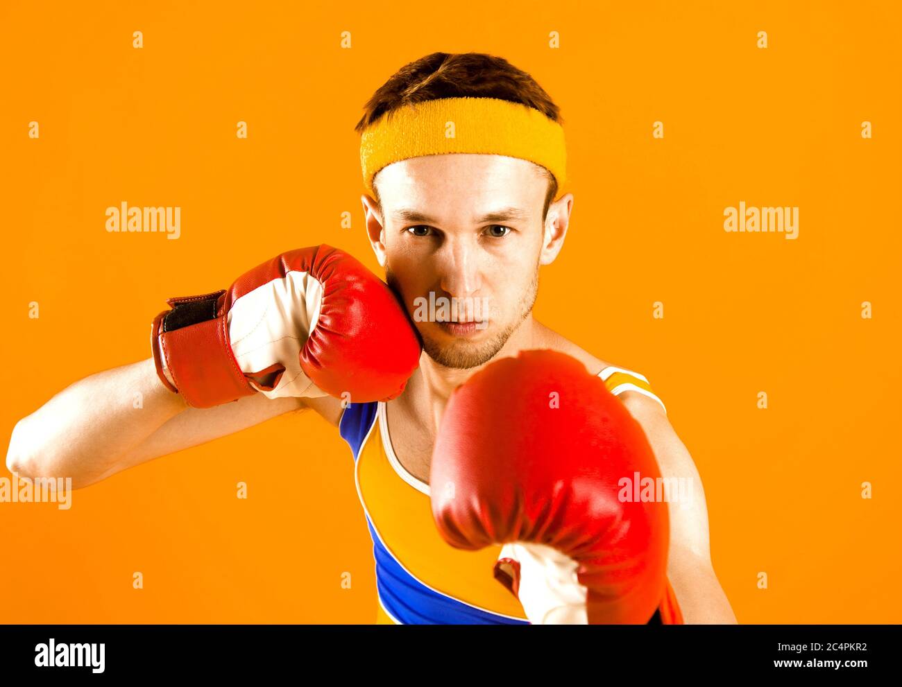 Funny skinny boxer man with red boxing gloves Stock Photo Alamy