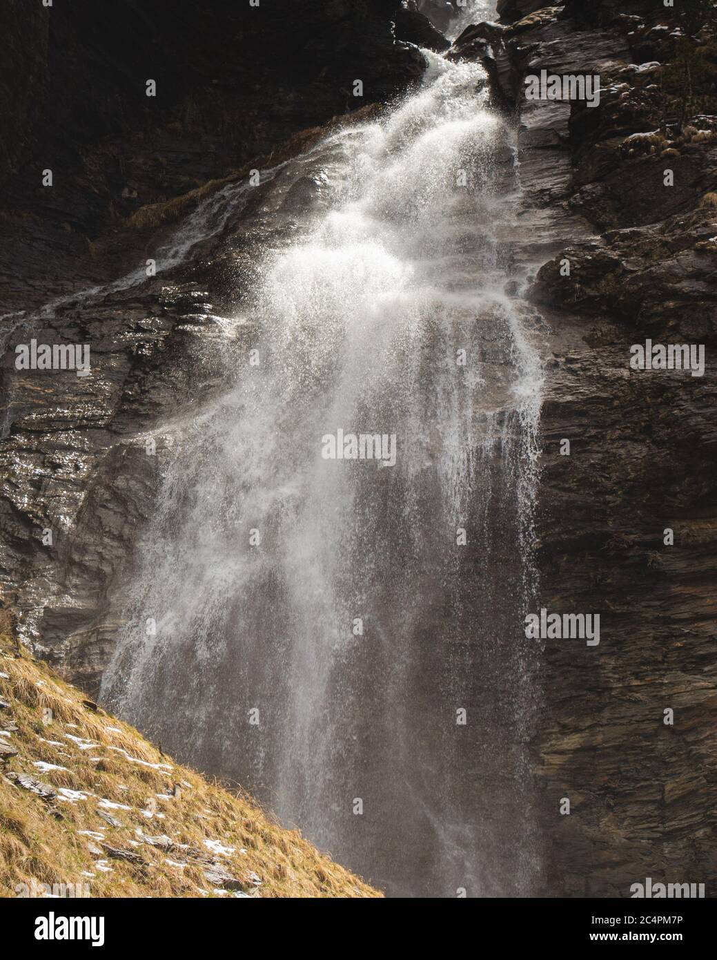 Stunning waterfall with dark background Stock Photo - Alamy