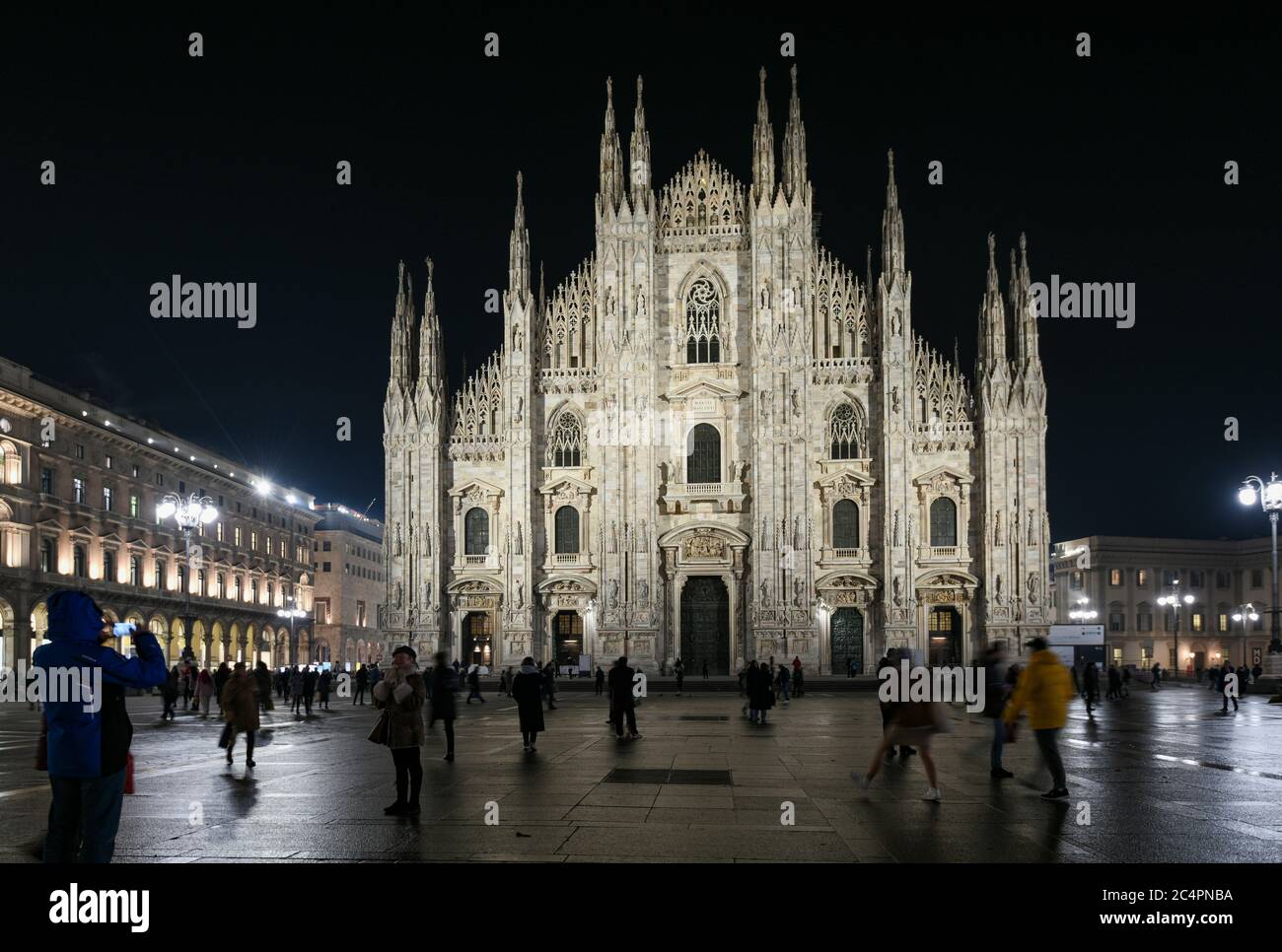 Milan, Italy - January 11, 2020: People in front of Milan Cathedral – Mariae Nascenti at night Stock Photo