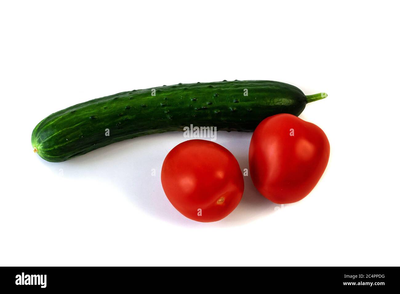 Isolated on white background cucumber and tomato Stock Photo Alamy