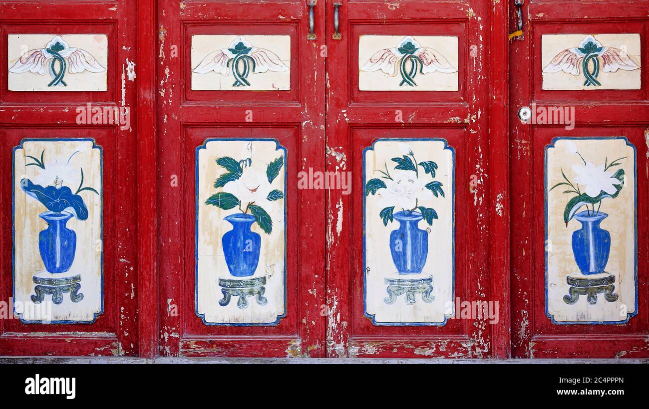 Buddhist auspicious symbols-ashtamangala on red door. Qianfo Grottoes-Mati Si Temple-Zhangye-China-0951 Stock Photo