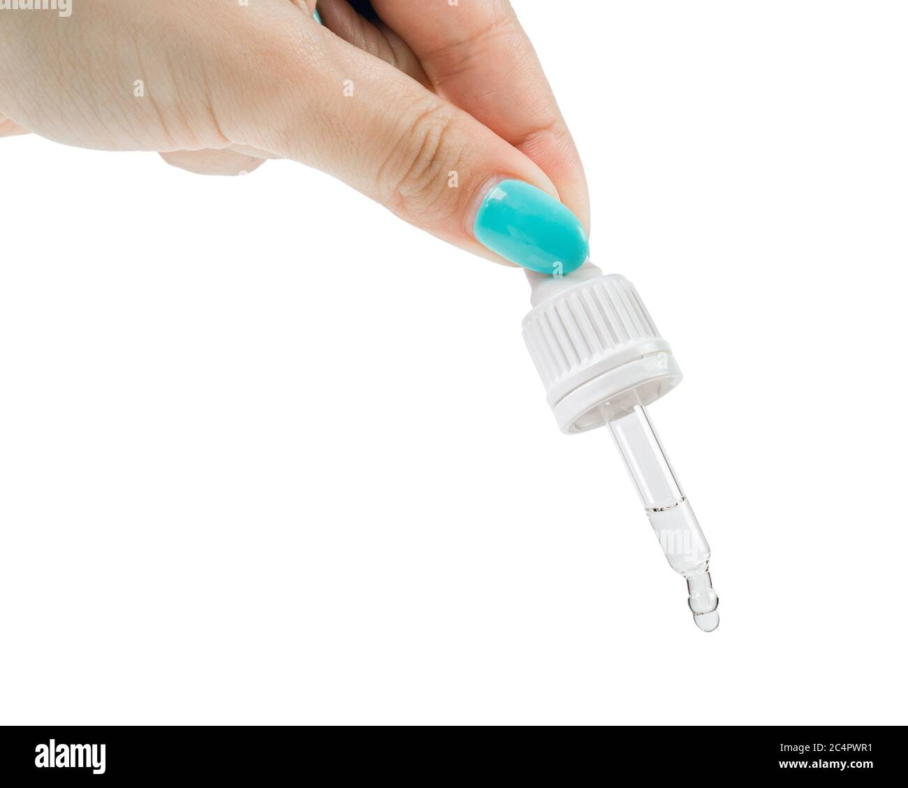 A woman's hand squeezes a clear liquid out of a pipette. Isolated on a