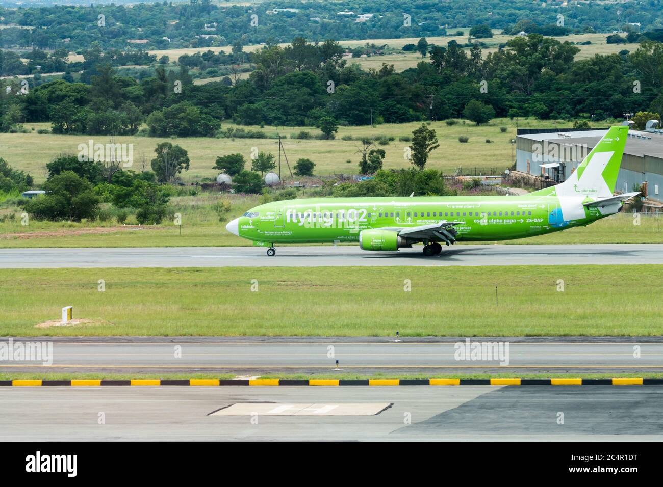 Kulula.com airplane or plane stationary on the runway at Lanseria airport, Gauteng, South Africa Stock Photo