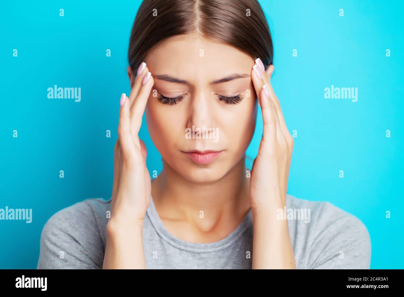 Head pain, exhausted young woman has suffering from unbearable headache ...