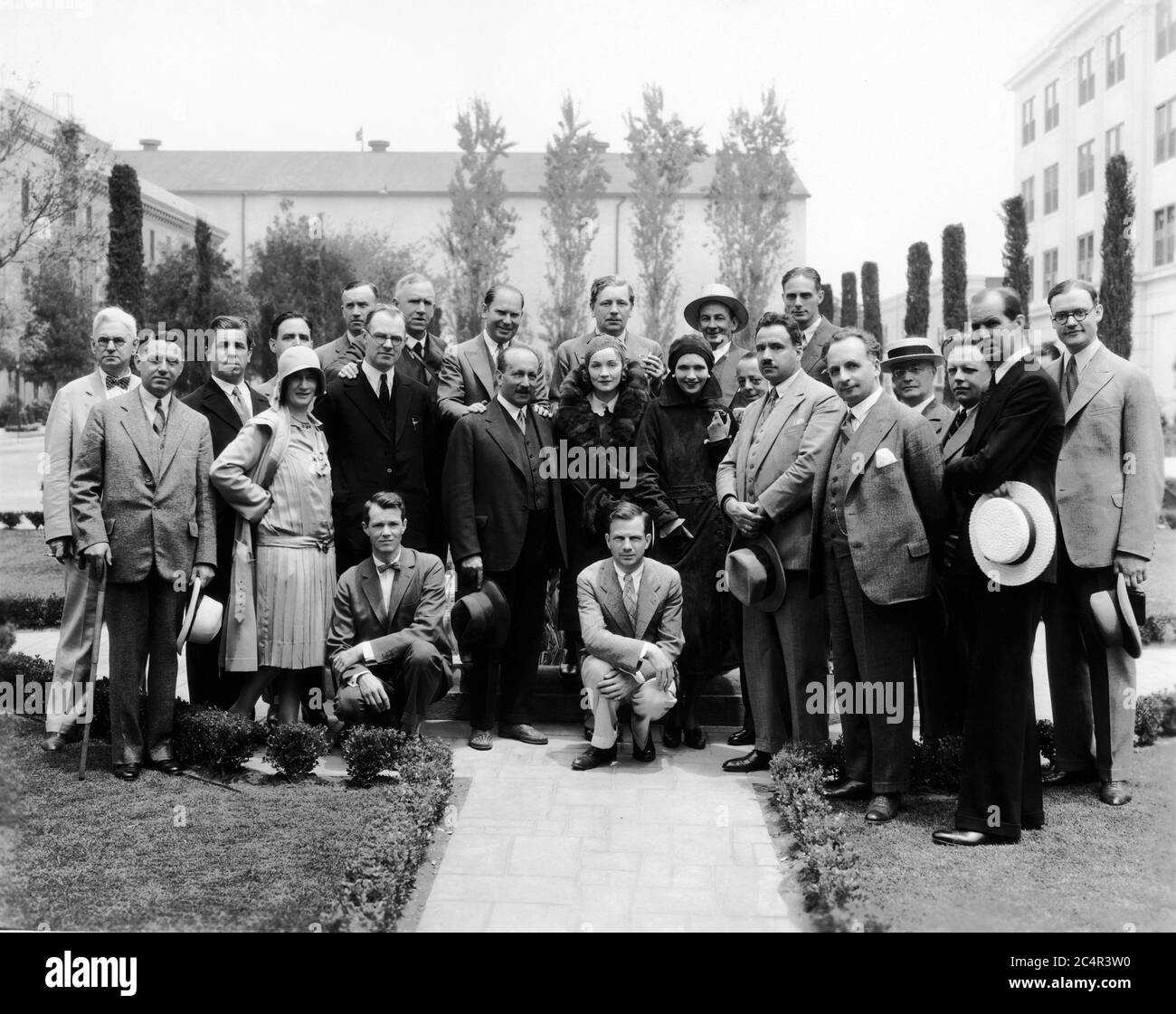 MARLENE DIETRICH and KAY FRANCIS pose with European Journalists including at left of Dietrich FELIX SALTEN (author of BAMBI) visiting Paramount Studios in Hollywood circa June 1930 Stock Photo