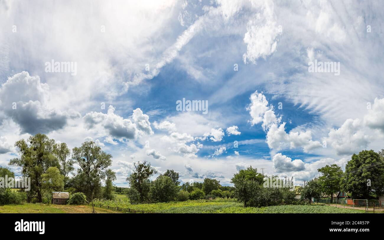 Blue sky with white clouds in a beautiful summer day Stock Photo - Alamy