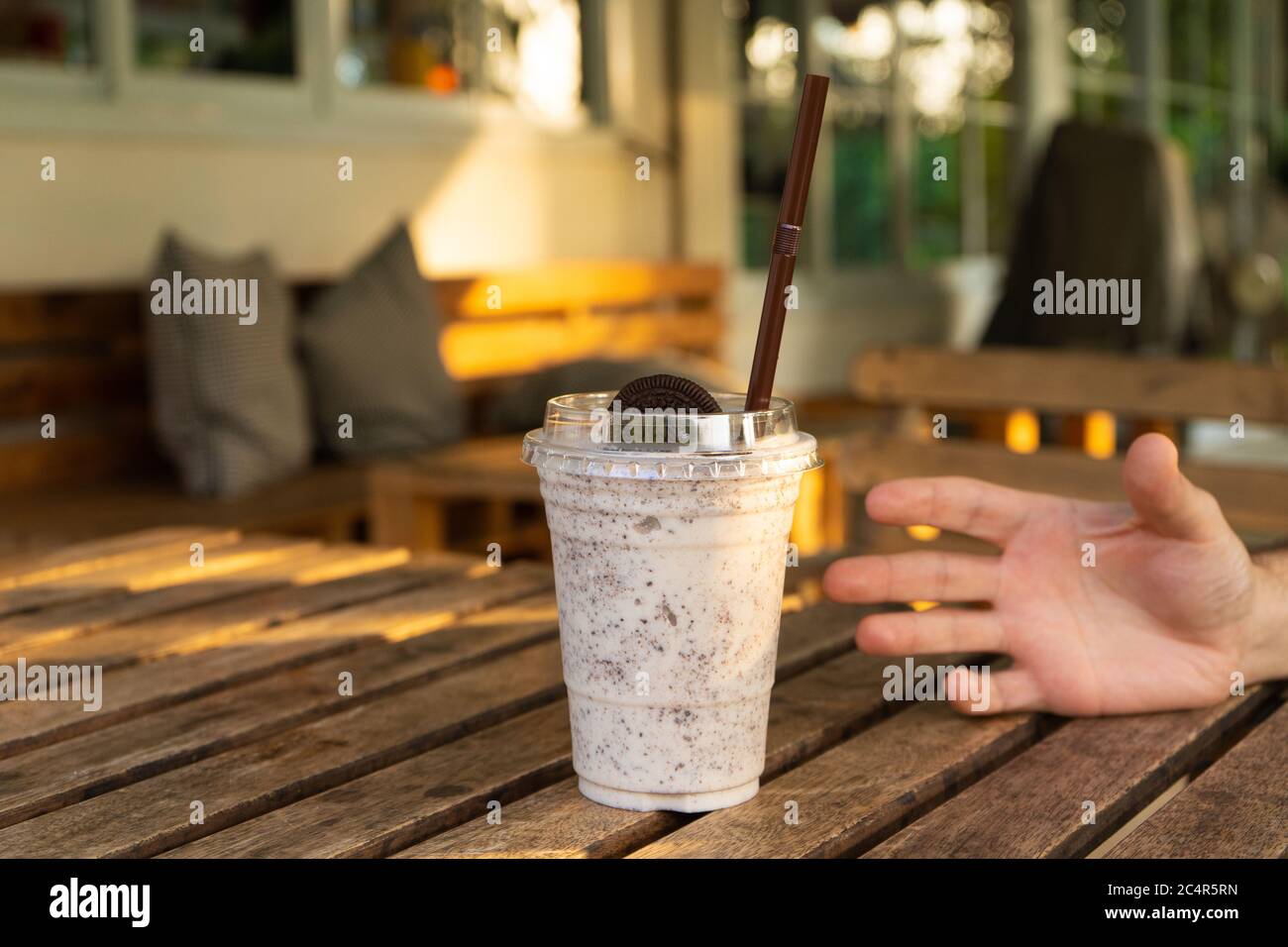 Milkshake with ice cream and oreo cookies. Cool and refreshing on a hot day. Stock Photo