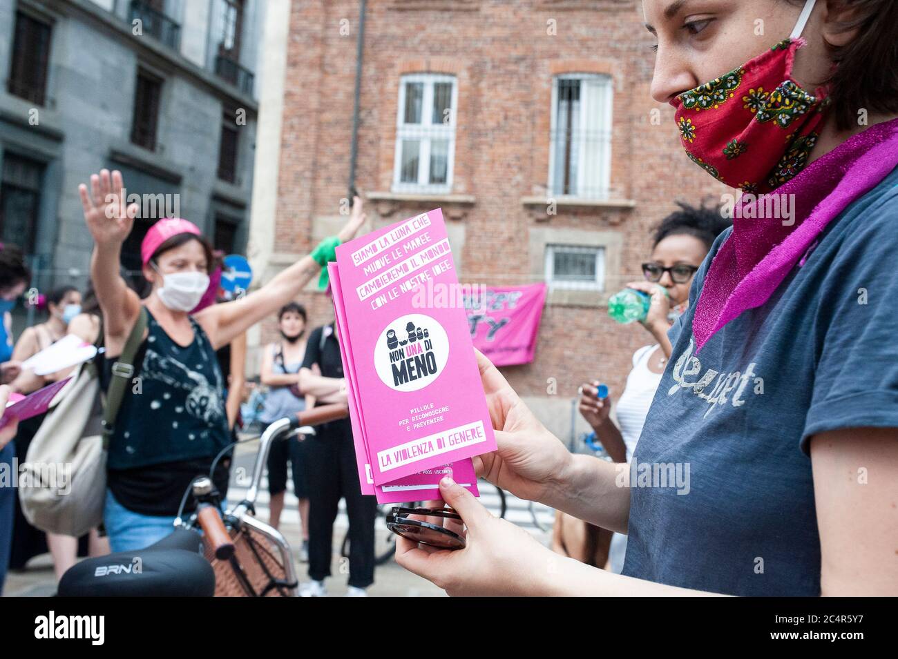 A protester holding a Non Una di Meno's brochure on gender violence during  the demonstration.The feminist movement, Not One Less (Non Una di Meno)  called for a nationwide demonstration “Don't wash dirty