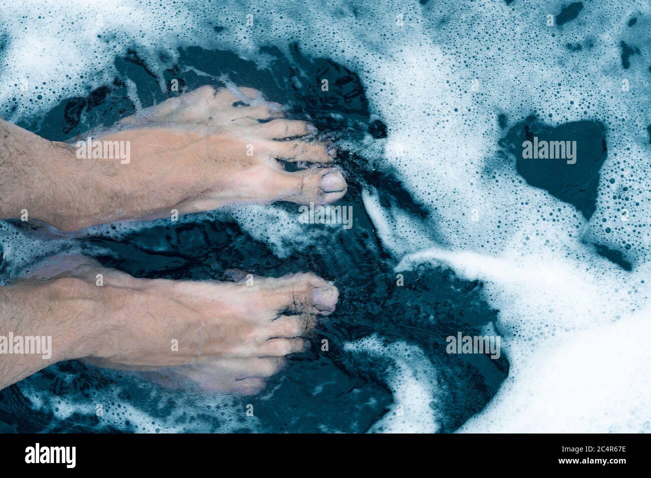 Male feet walking on sand hi-res stock photography and images - Alamy