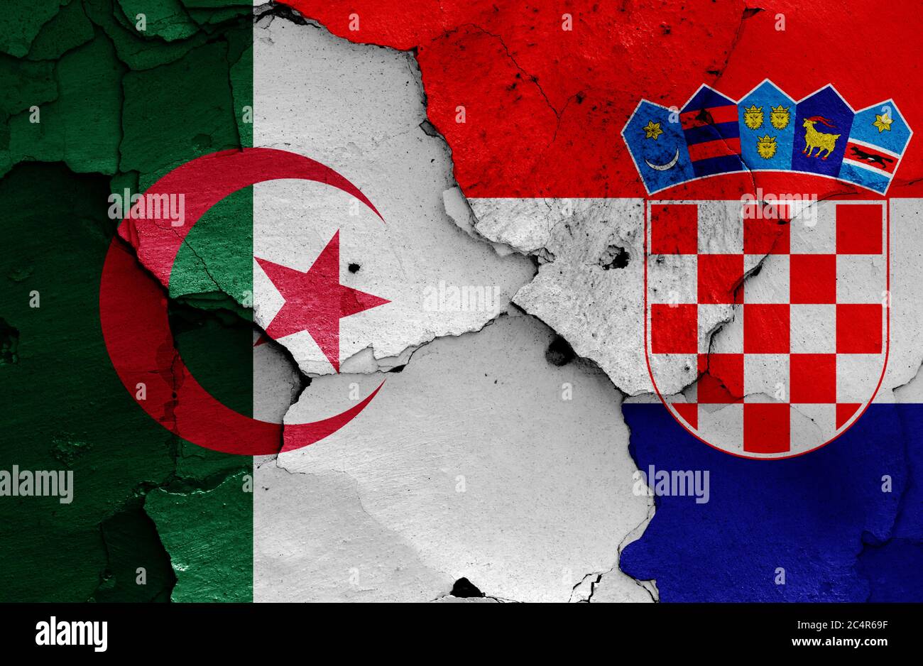 flags of Algeria and Croatia painted on cracked wall Stock Photo