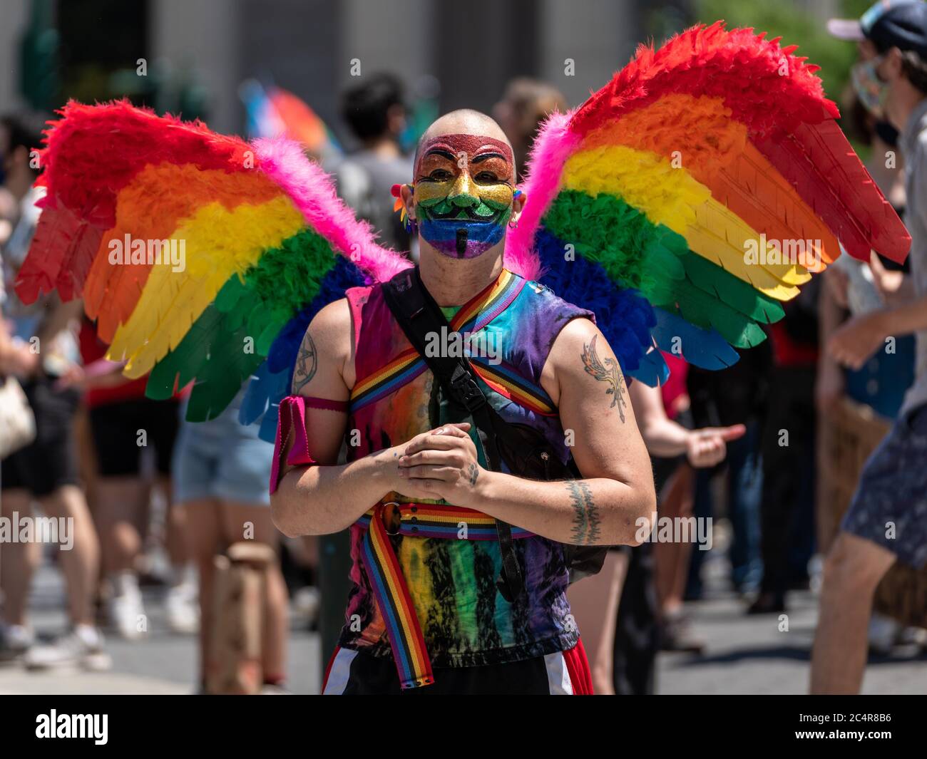 New York, New York, USA. 28th June, 2020. New York, New York, U.S.: a man wears rainbow wings and celebrates the 50th anniversary of the NYC Pride March during a Queer Liberation March in support for Black Lives Matter and against police brutality at Foley Square. Credit: Corine Sciboz/ZUMA Wire/Alamy Live News Stock Photo