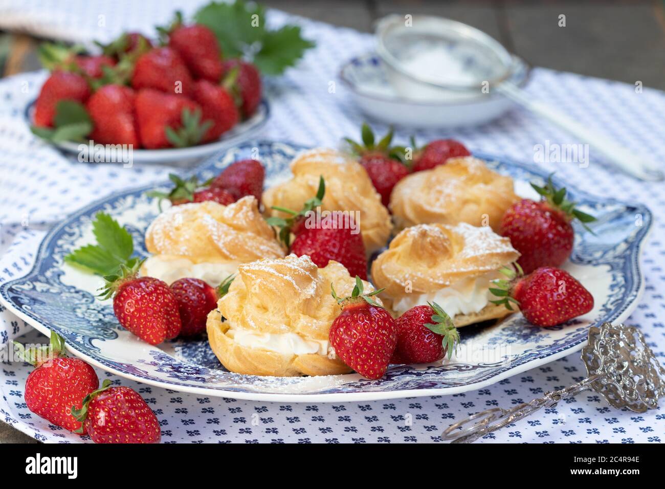 cream puffs and strawberry on the plate Stock Photo