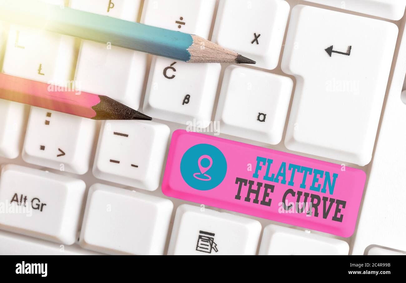 Writing note showing Flatten The Curve. Business concept for raising an awareness on slowing the rate of the infectious disease White pc keyboard with Stock Photo