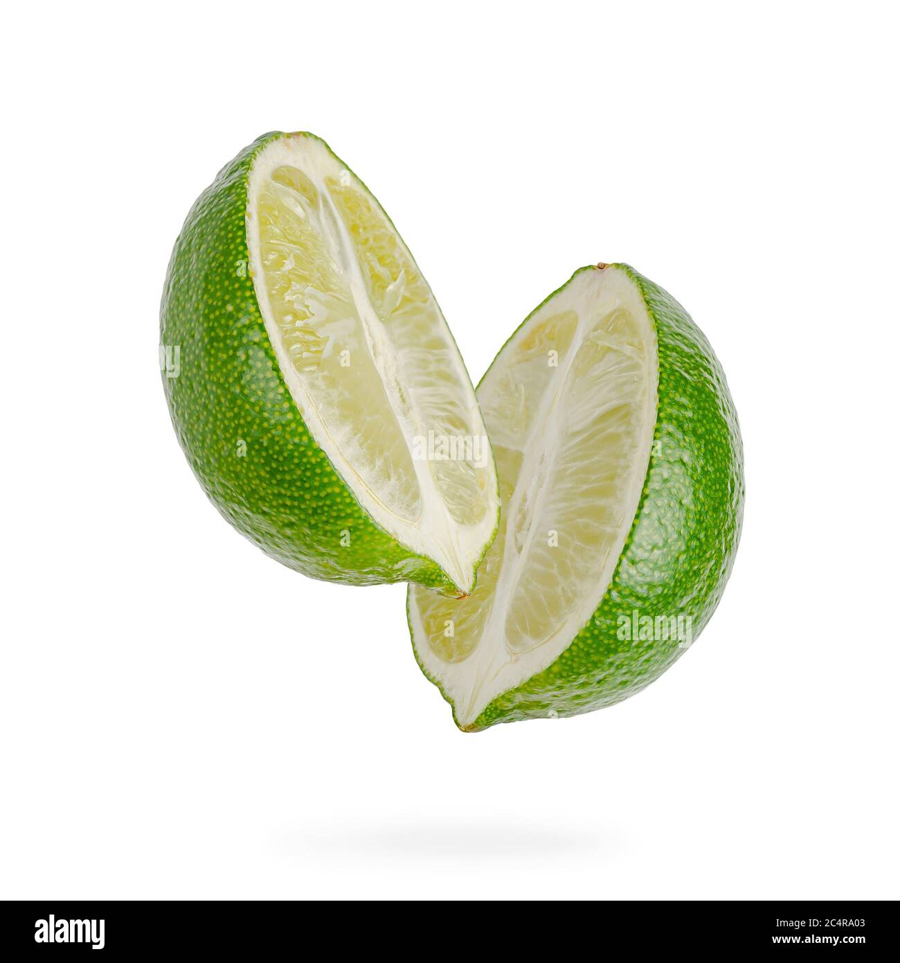Two halves of lime isolated on white background. Stock Photo