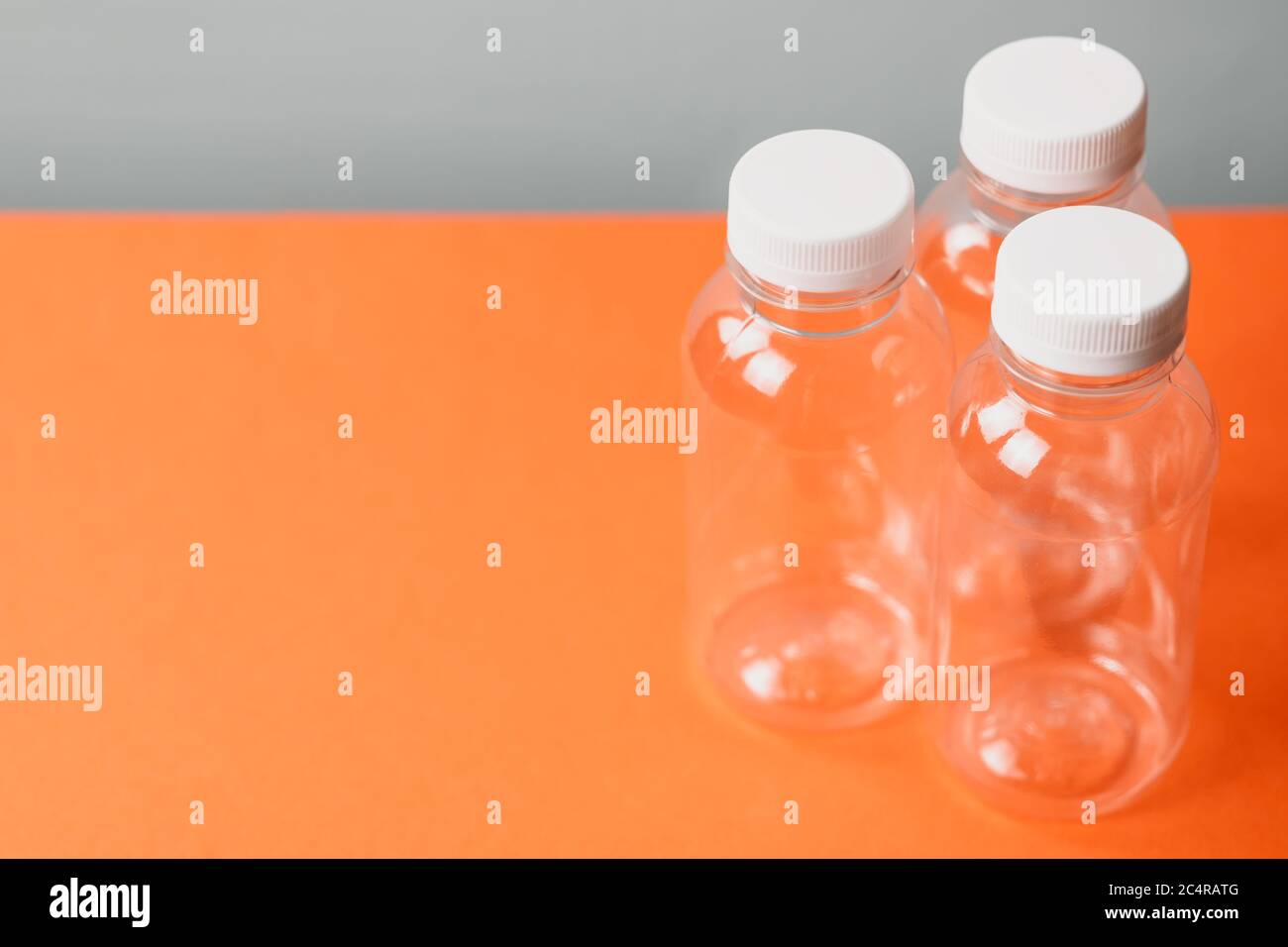 Eco plastic bottles on colour background Stock Photo - Alamy