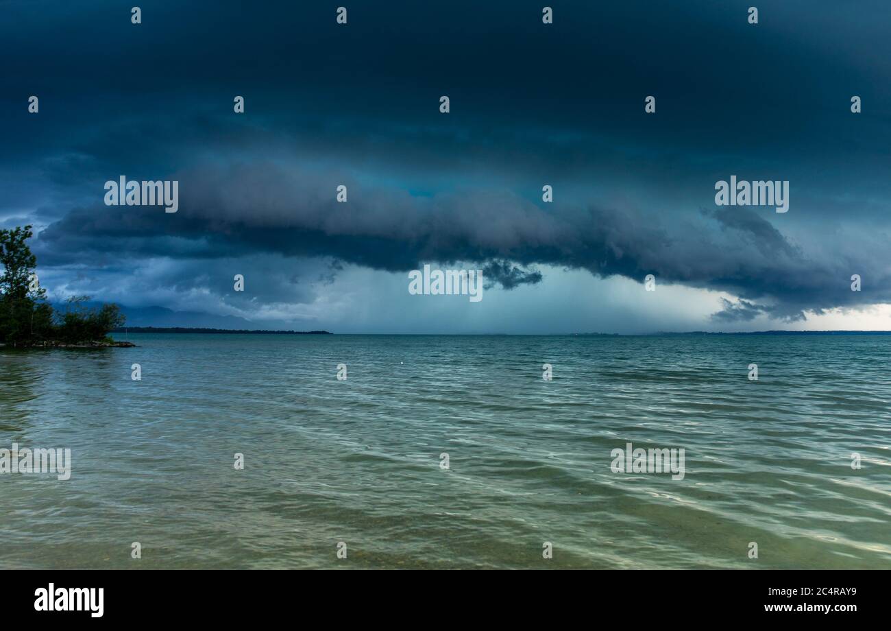 Chieming, Germany. 28th June, 2020. A thunderstorm front moves over the Chiemsee. Credit: Bernd März/dpa/Alamy Live News Stock Photo