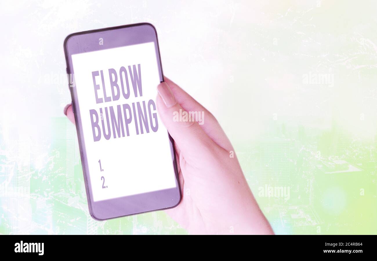 Conceptual hand writing showing Elbow Bumping. Concept meaning