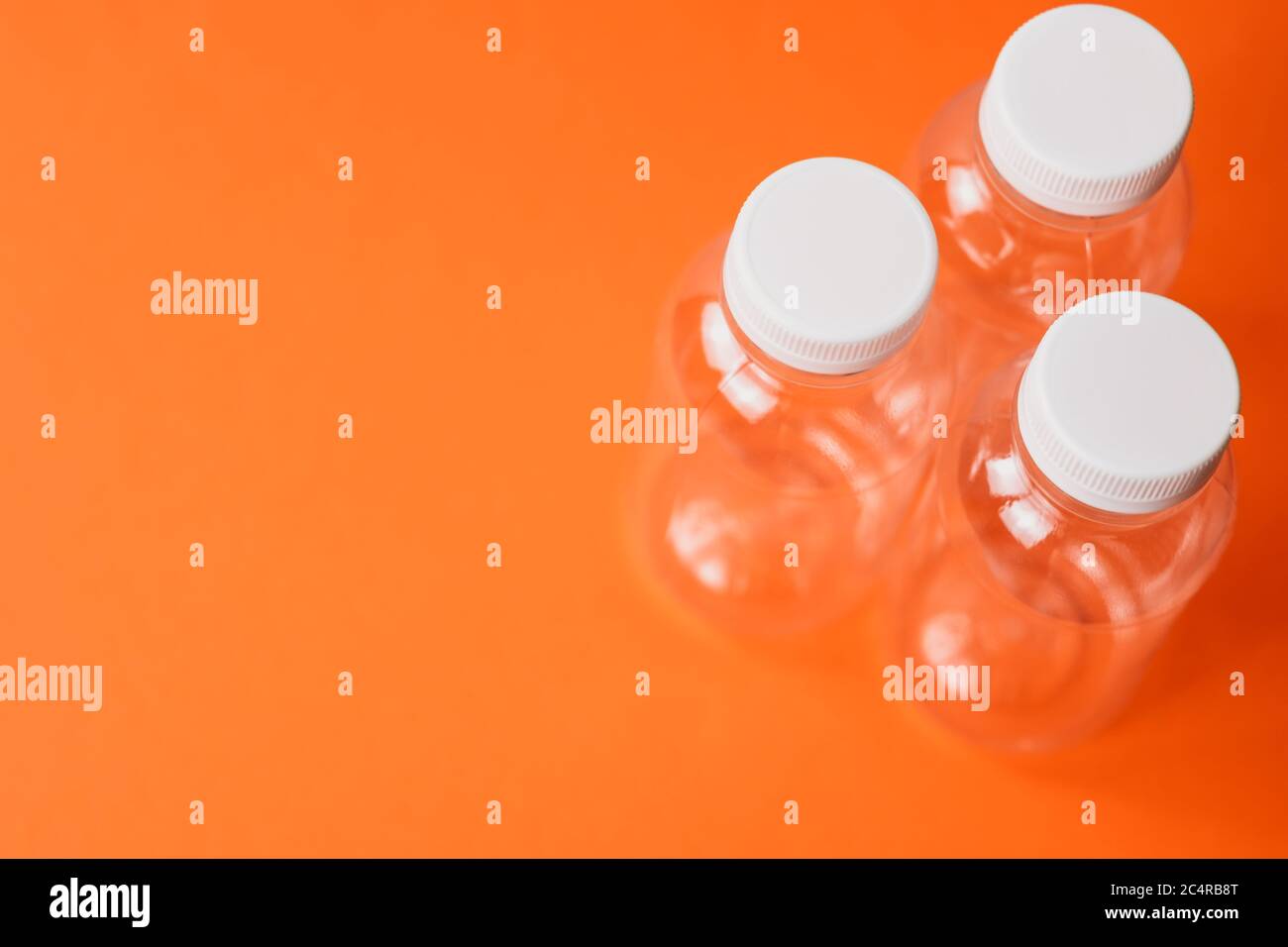 Eco plastic bottles on colour background Stock Photo - Alamy