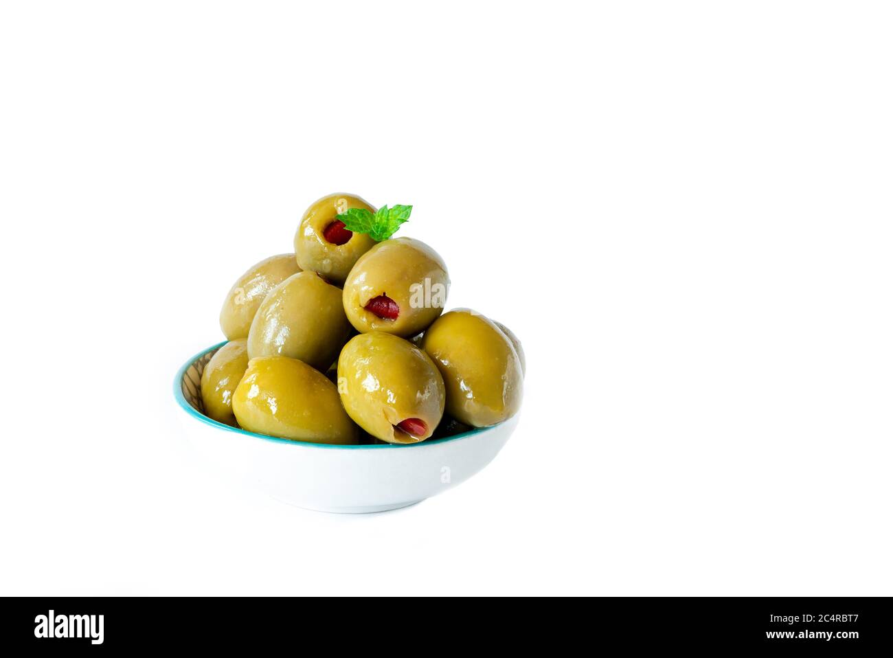 Green olives with pimento on white background Stock Photo Alamy
