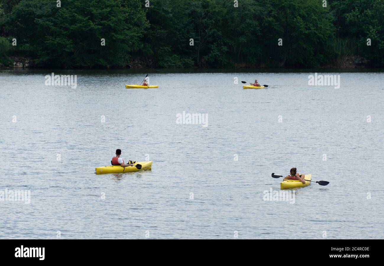 Four yellow kayaks in a square kayaking at overpeck park Hackensack River Keepers photograph Stock Photo