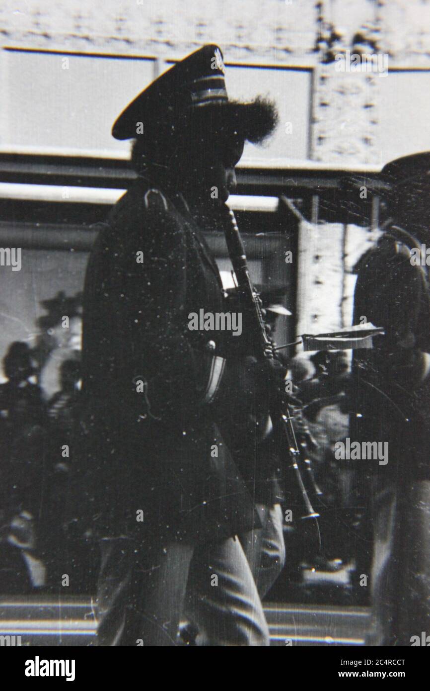 Fine 70s vintage black and white photography of a high school band clarinet player on parade in downtown Chicago, Illinois. Stock Photo