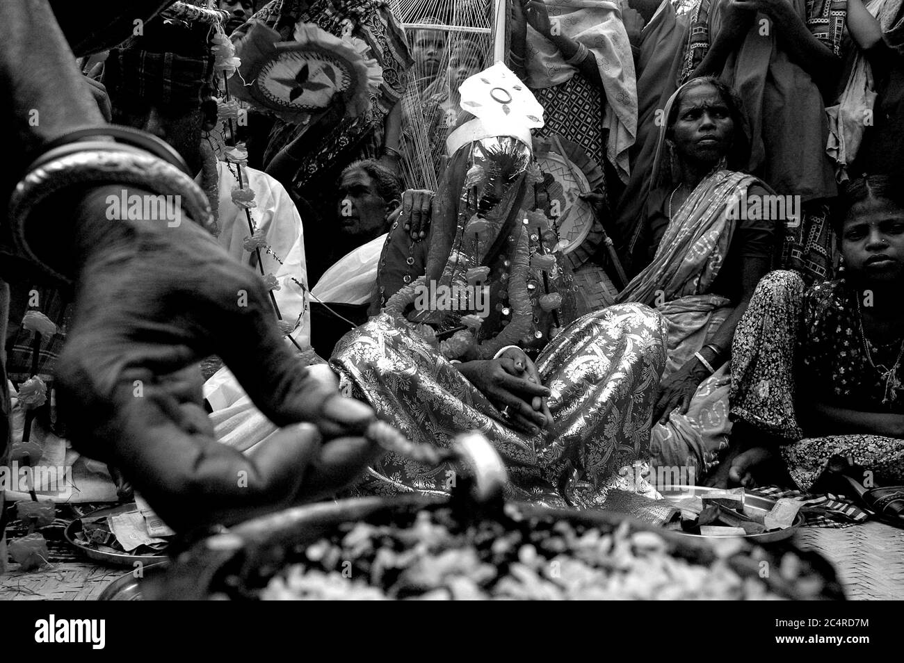 A marriage ceremony taking place in a tea garden. The ceremony ends