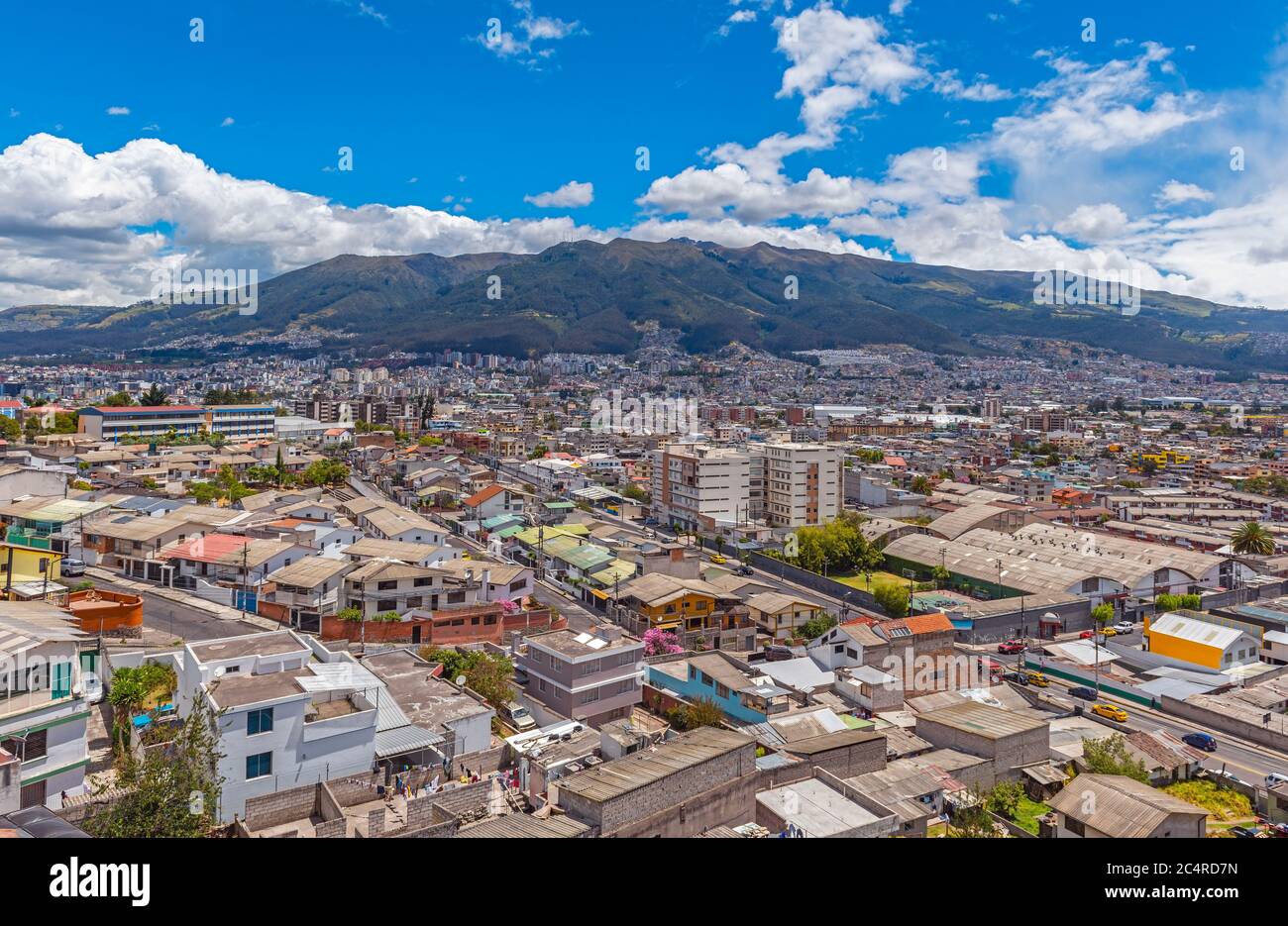 Aerial urban skyline of Quito city with the Pichincha volcano, Ecuador. Stock Photo