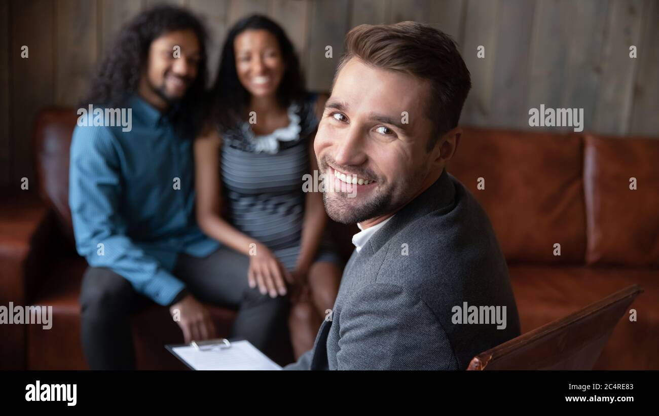 Marriage counselor portrait, happy african couple on background Stock Photo