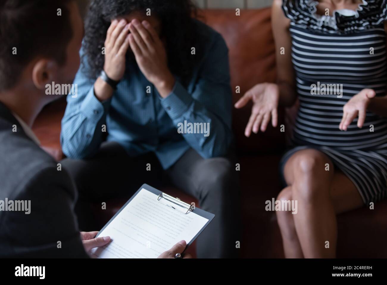 African married couple during visit with marriage therapist Stock Photo