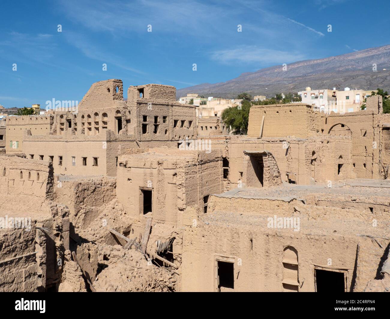 Exterior view of a mostly abandoned mud construction houses in Bait Al Safah, Al Hamra, Sultanate of Oman. Stock Photo