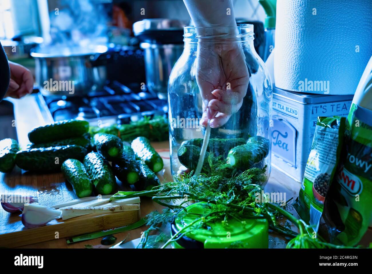 Pickle Cucumber in the jar - pickle preparation process in the kitchen shelf ...