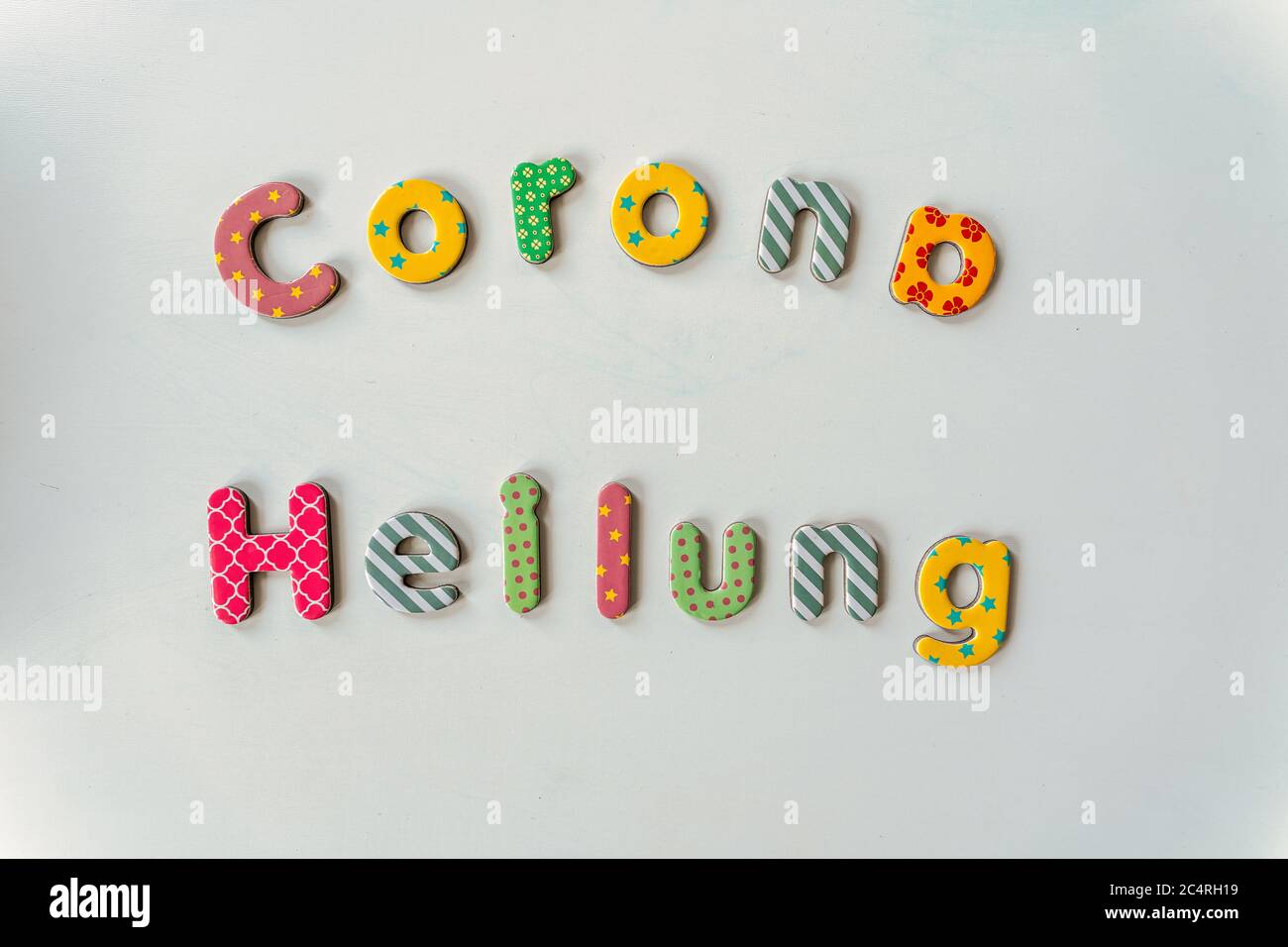 Corona Heilung - corona healing, typography in german letters. Stock Photo