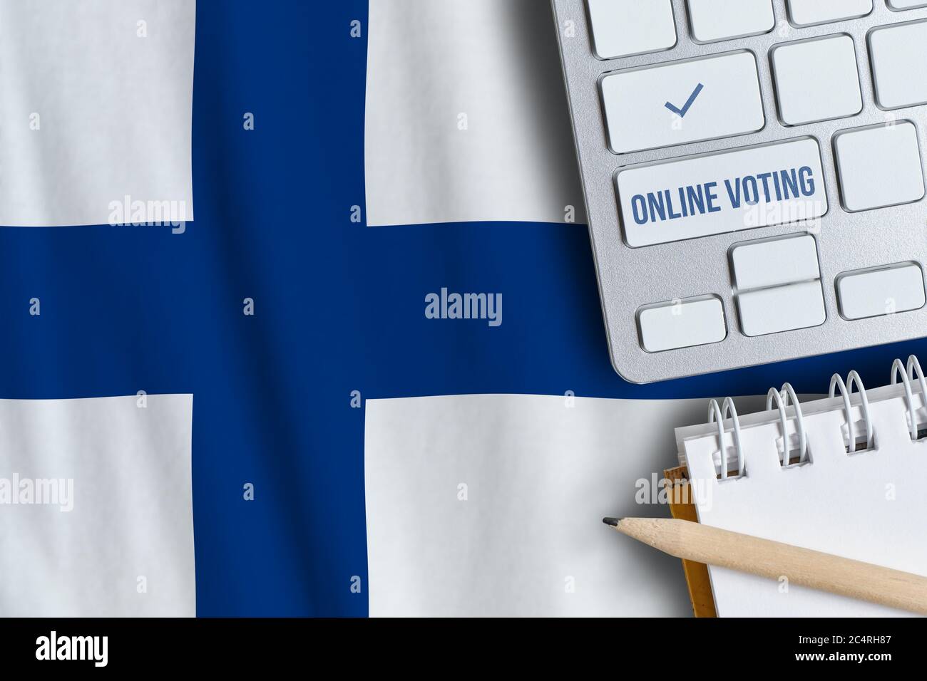 Online voting concept in Republic of Finland. Keyboard near country flag. Stock Photo