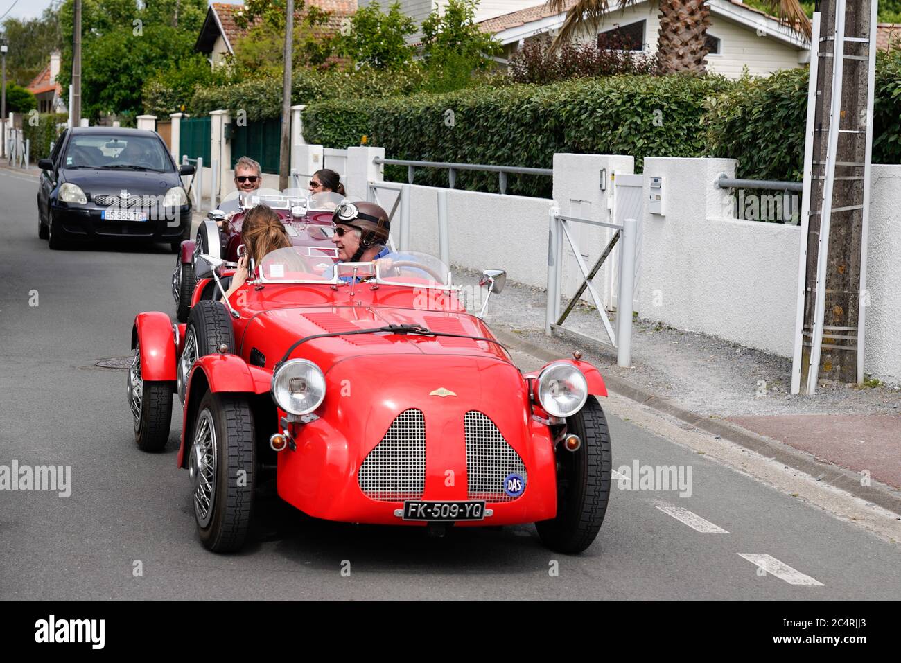 Bordeaux , Aquitaine / France - 06 20 2020 : Lomax Red car roadster in street from 2cv citroen Stock Photo