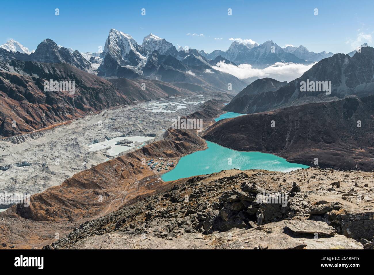 Emerald lakes, snow-capped himalayan peaks and the massive Ngozumpa glacier make the view from Gokyo Ri in Nepal one of the best in the world. Stock Photo