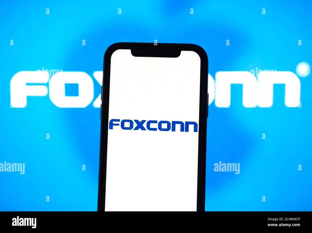 Foxconn logo on the smartphone screen Stock Photo - Alamy