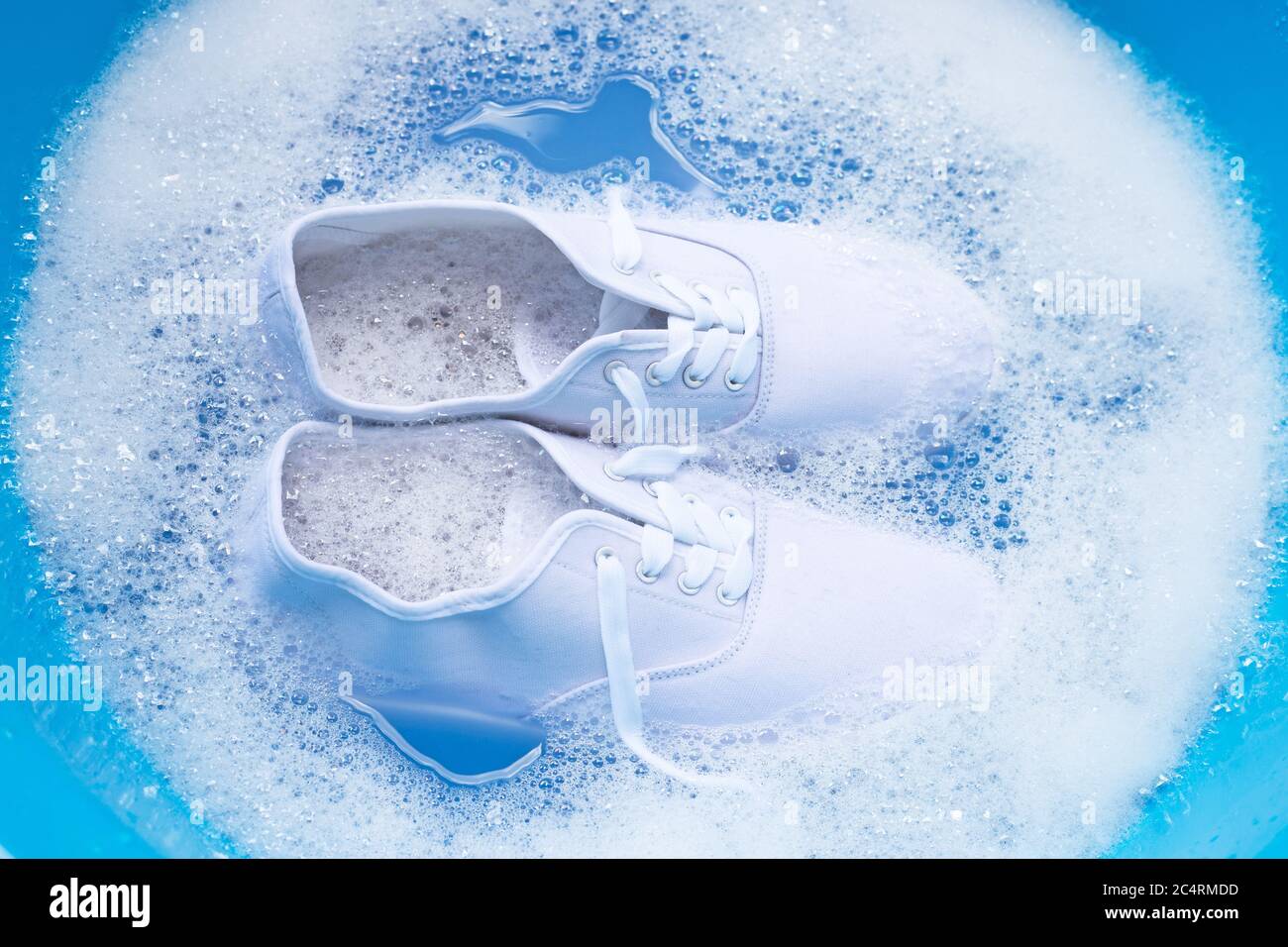 Soak shoes before washing. Cleaning Dirty sneakers Stock Photo - Alamy