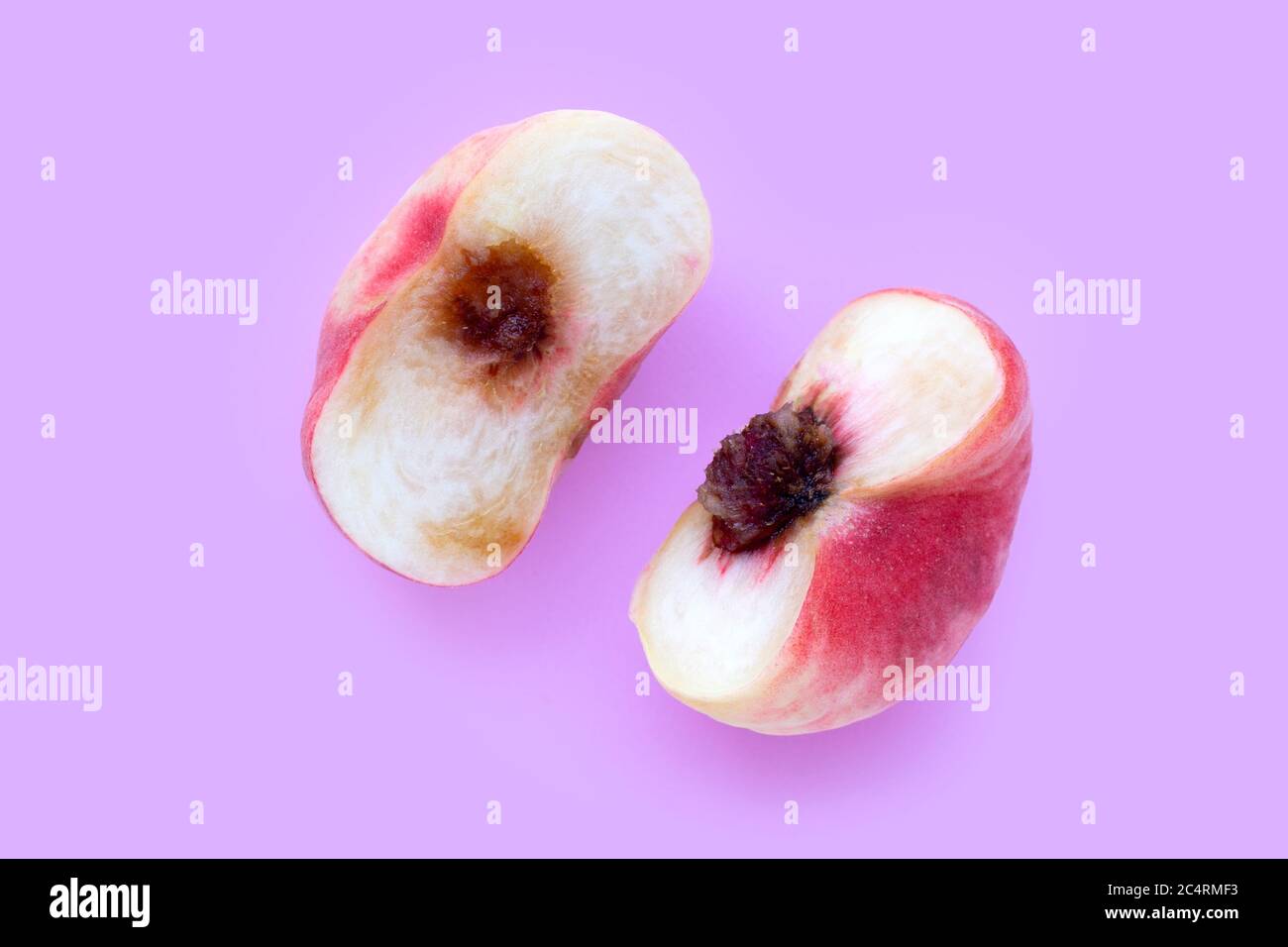 Chinese flat peaches on pink background. Top view Stock Photo