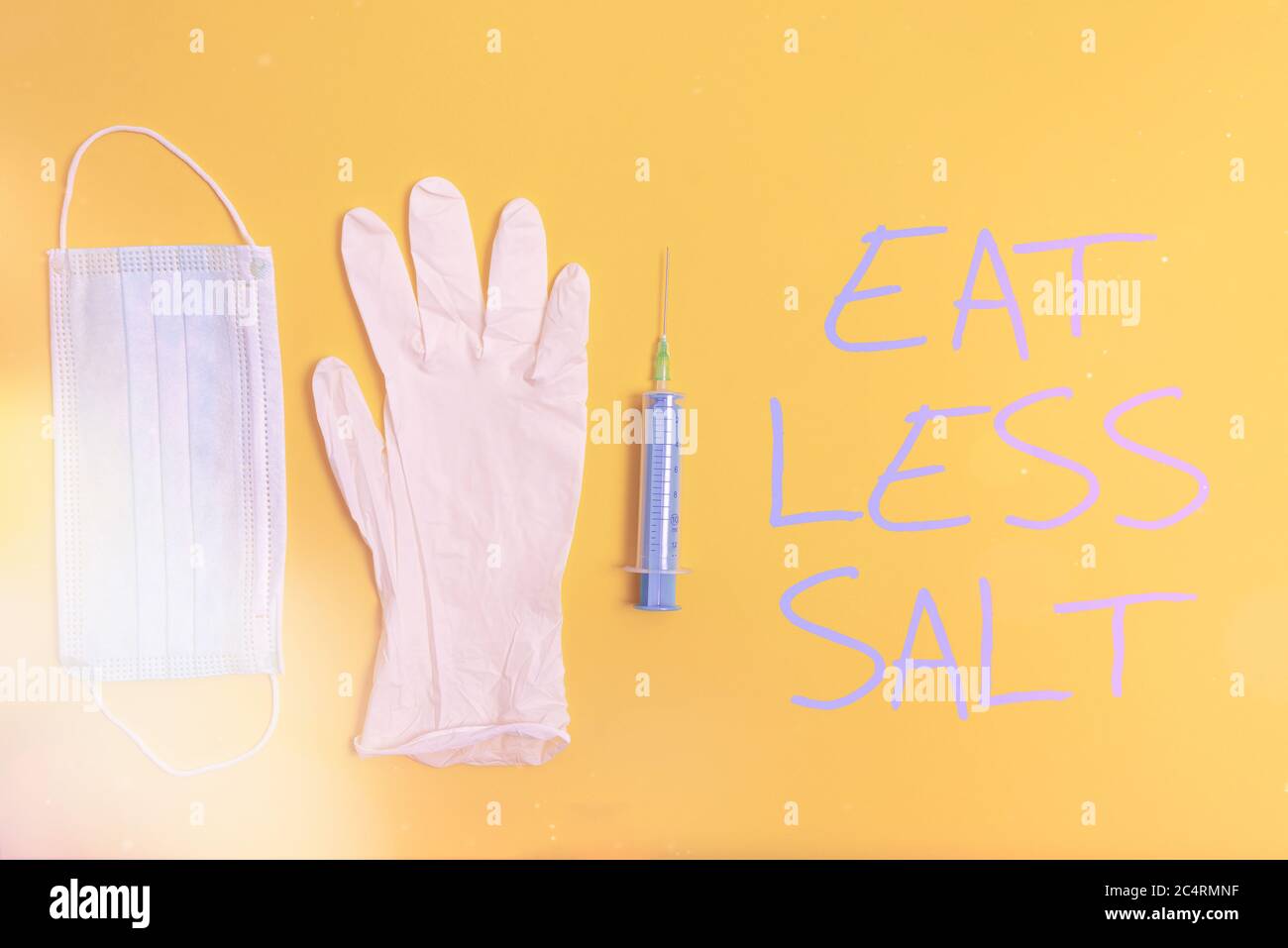 Text sign showing Eat Less Salt. Business photo text reducing the sodium intake on the food and beverages Primary medical precautionary equipments for Stock Photo