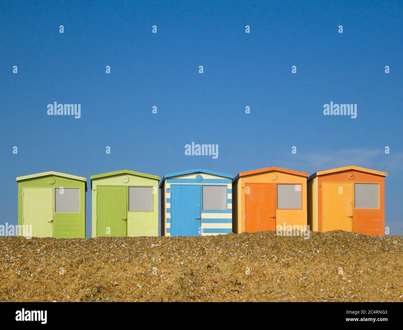 Colourful British beach huts in a row at Seaford, East Sussex Stock Photo