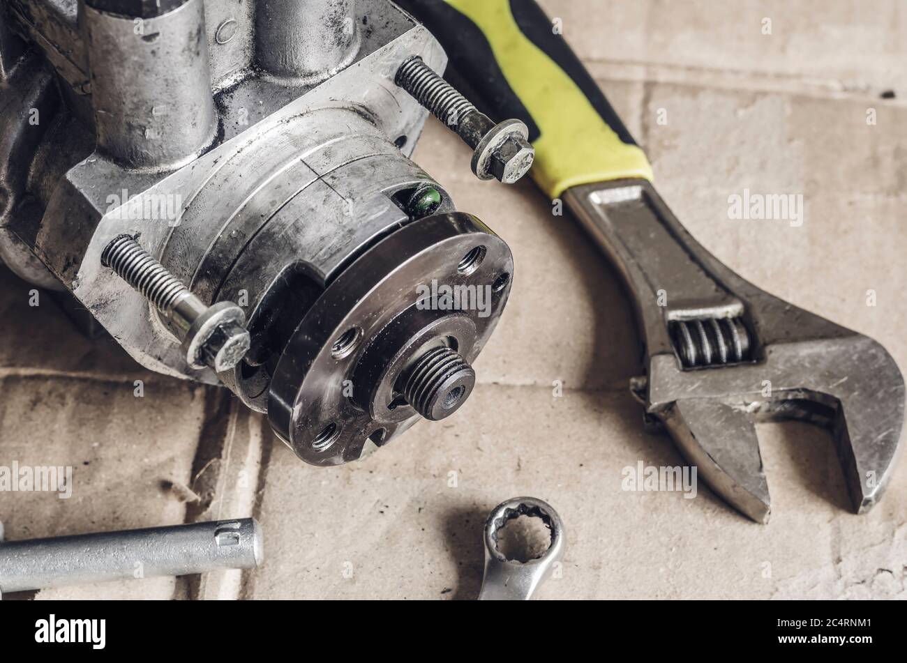 High pressure diesel fuel pump and wrenches. Drive shaft with a pulley