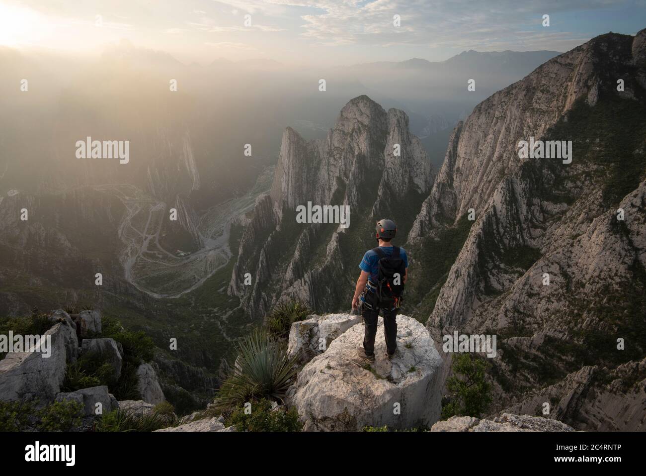 One man standing on a cliff on his way to Nido de Aguiluchos. Stock Photo