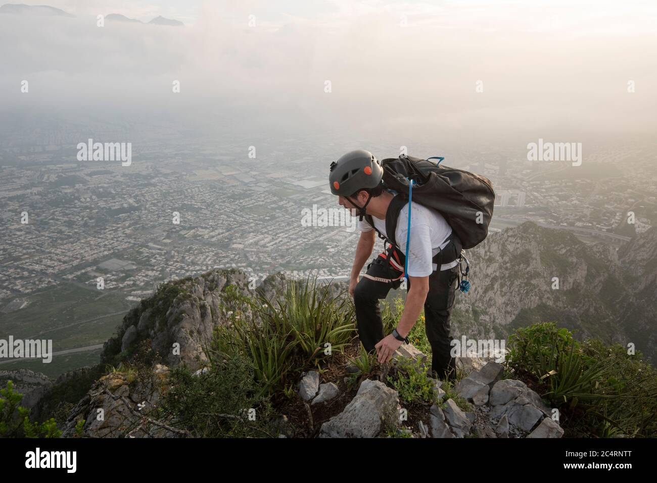 One man standing on a cliff on his way to Nido de Aguiluchos Huasteca Stock Photo