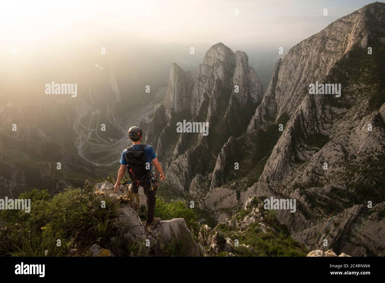 One man standing on a cliff on his way to Nido de Aguiluchos Huasteca Stock Photo