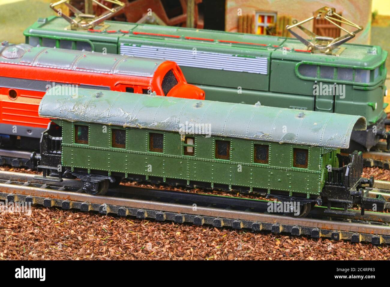 Closeup of model railway carriage on the rail tracks. Perfect model of