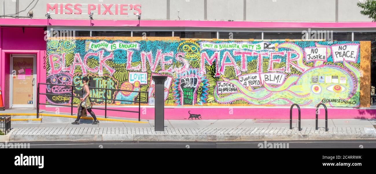 Enormous Black Lives Matter  mural by artist @dearestdieglow fills the boards covering the window of Miss Pixie's Furnishings & Whatnot, on 14th Stree Stock Photo